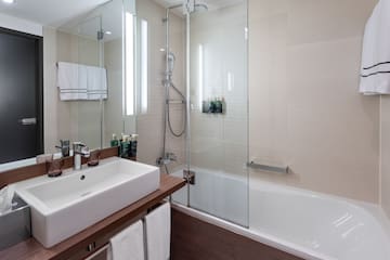 a bathroom with a glass shower door