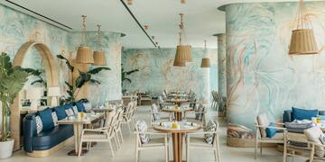 a restaurant with tables and chairs