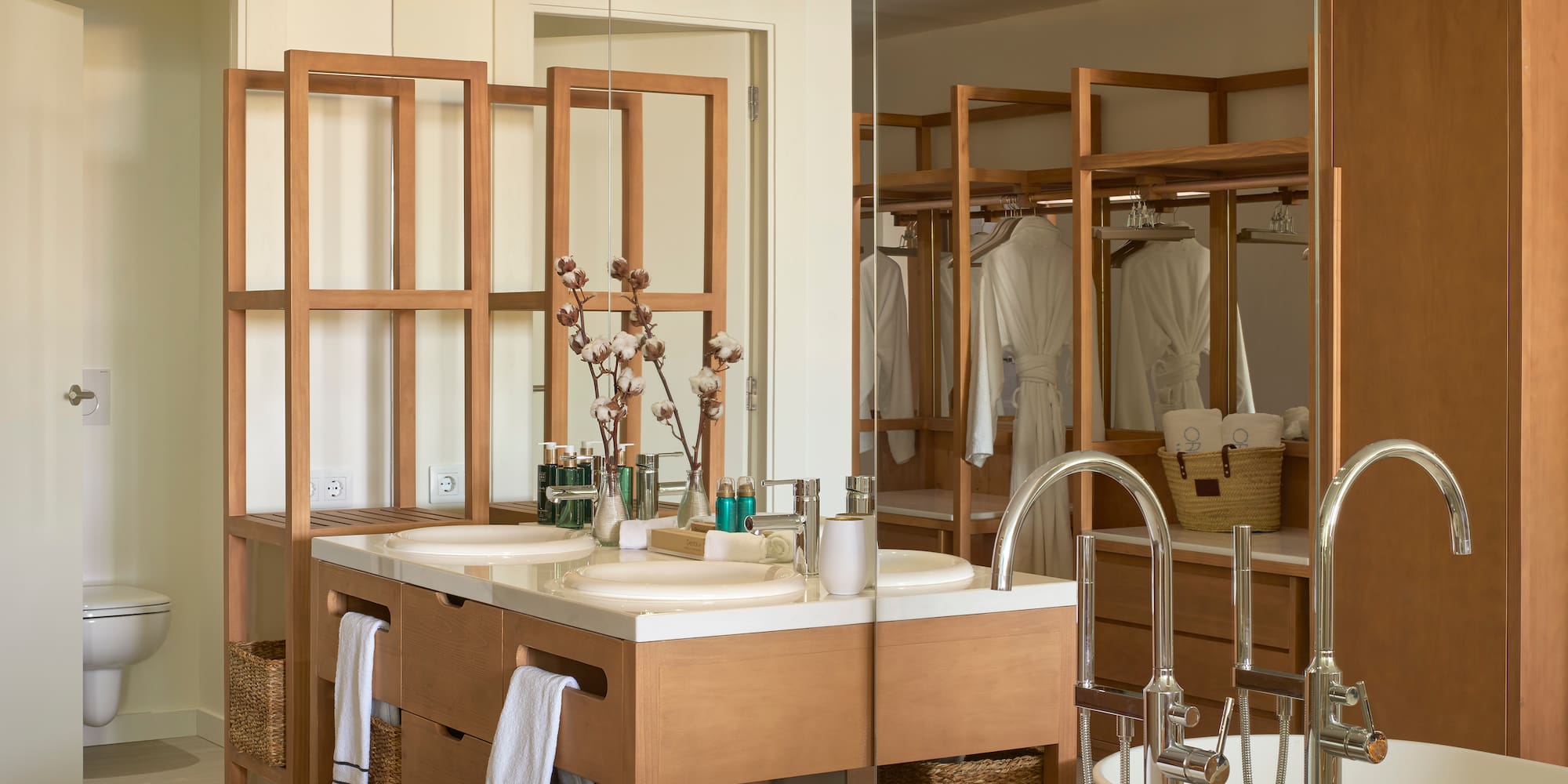 a bathroom with a large mirror and a sink