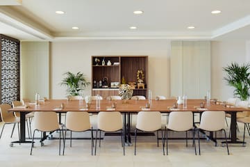a large conference room with a table and chairs
