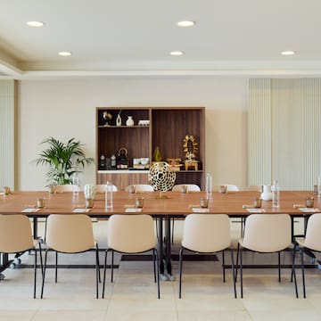 a large conference room with a table and chairs