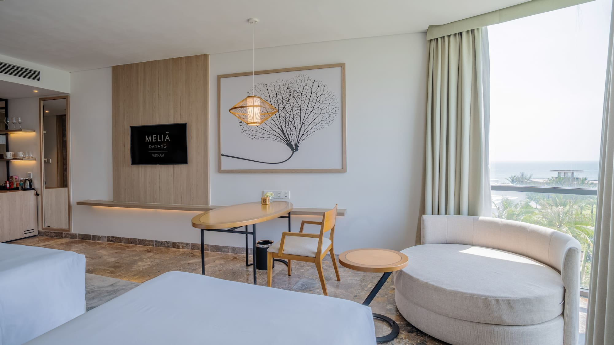 a room with a bed and a table and chairs