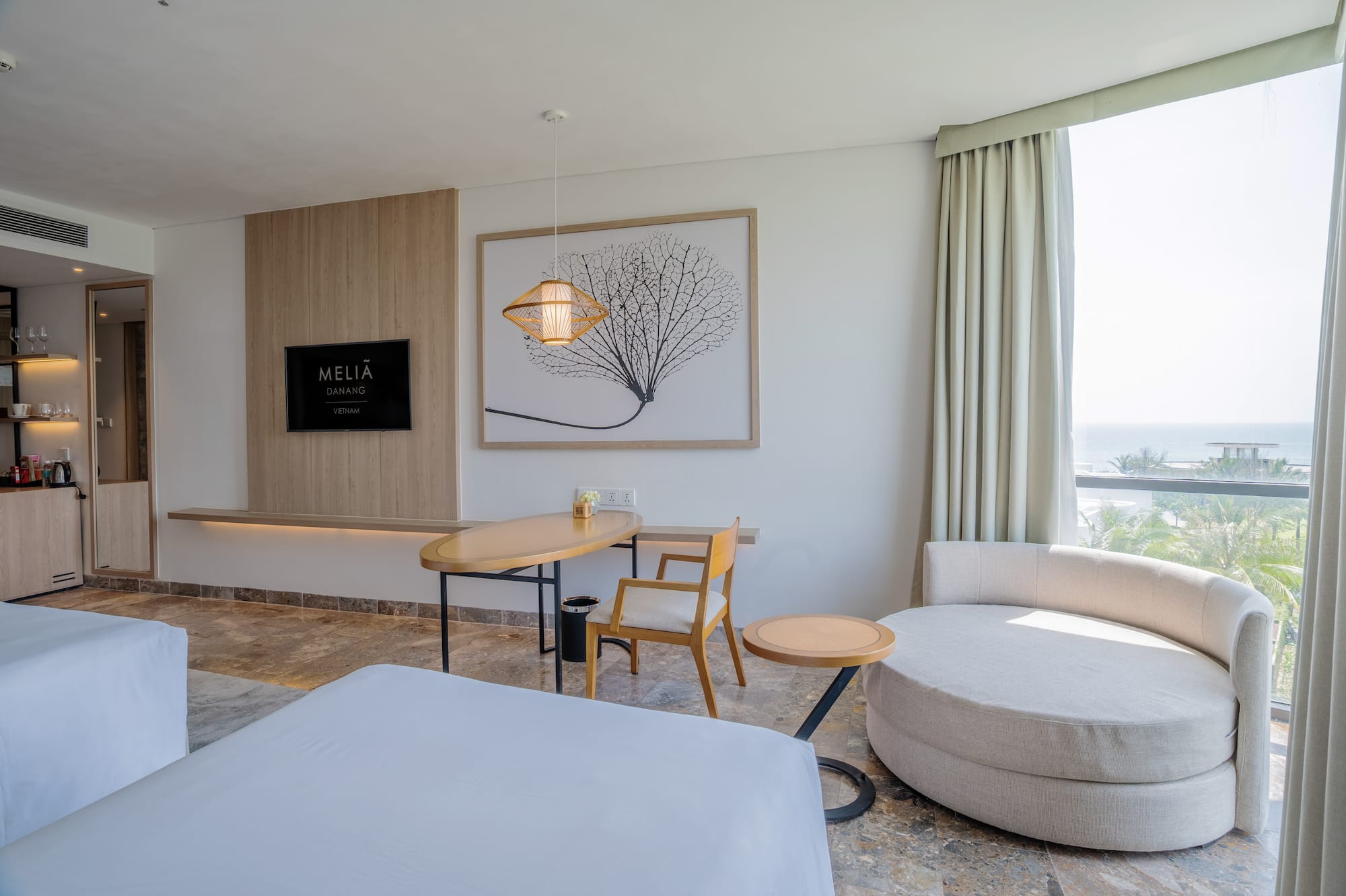 a room with a bed and a table and chairs