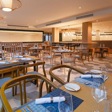 a restaurant with tables and chairs