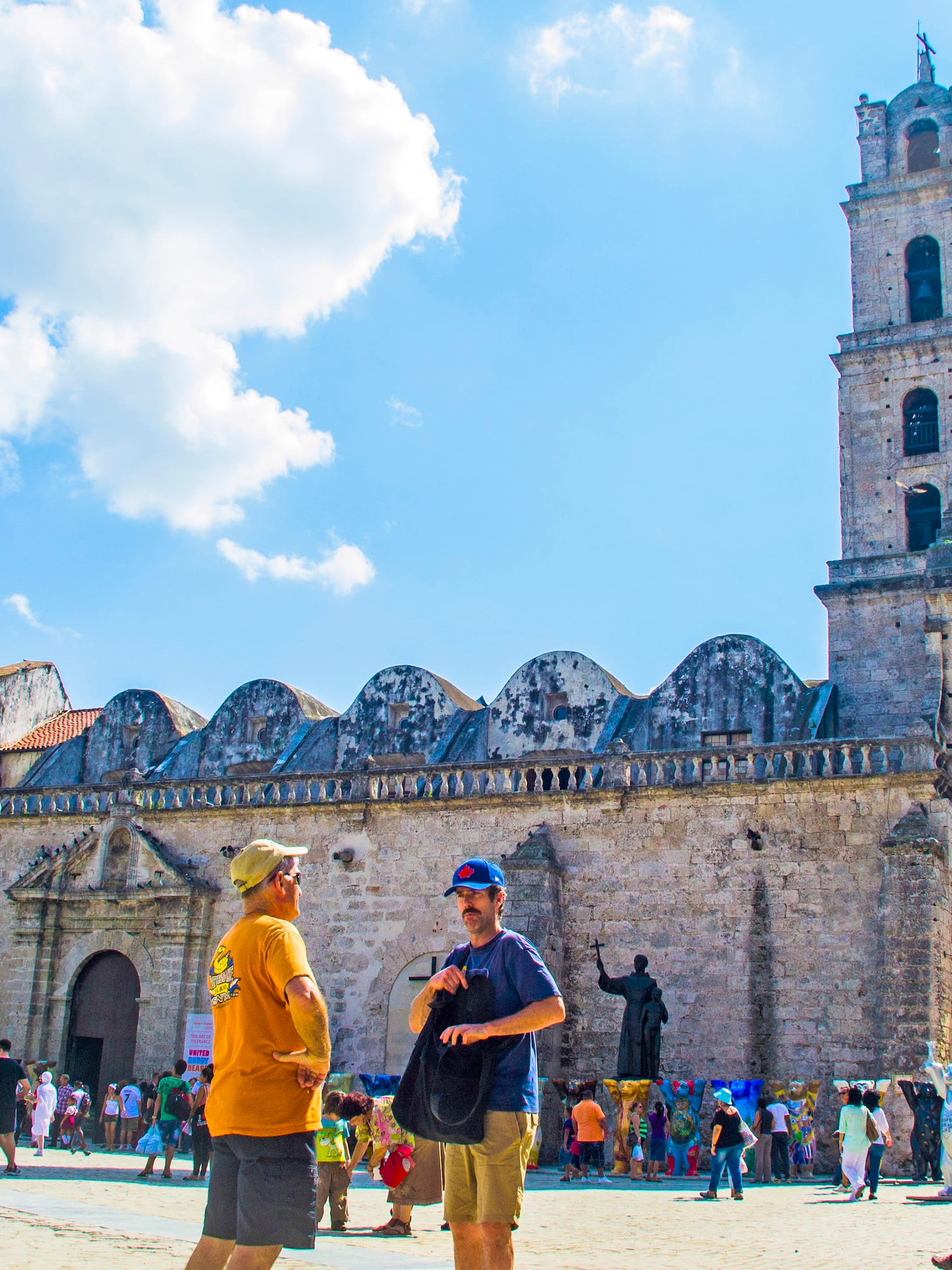 a group of people in front of a stone building