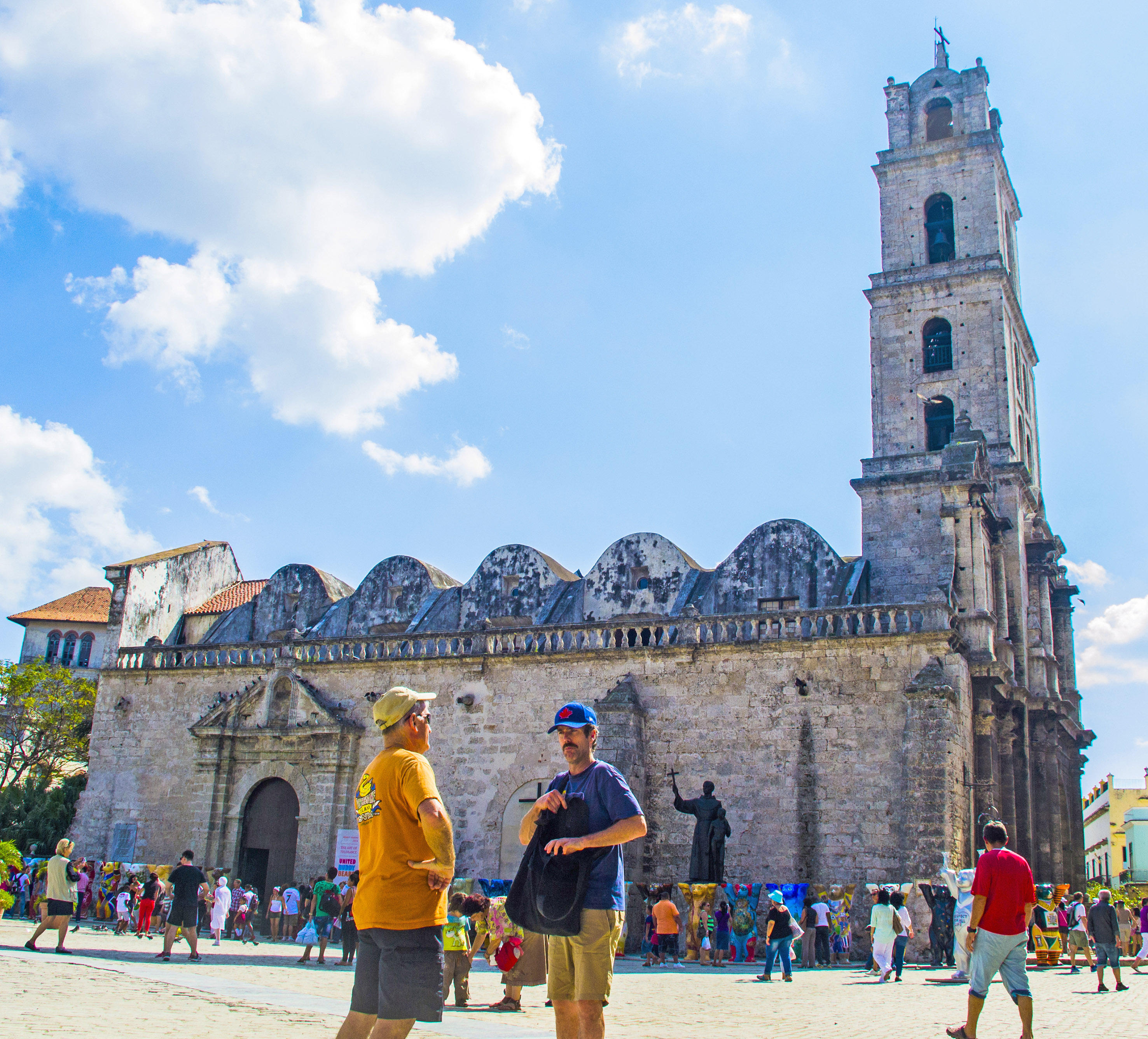 a group of people in front of a stone building