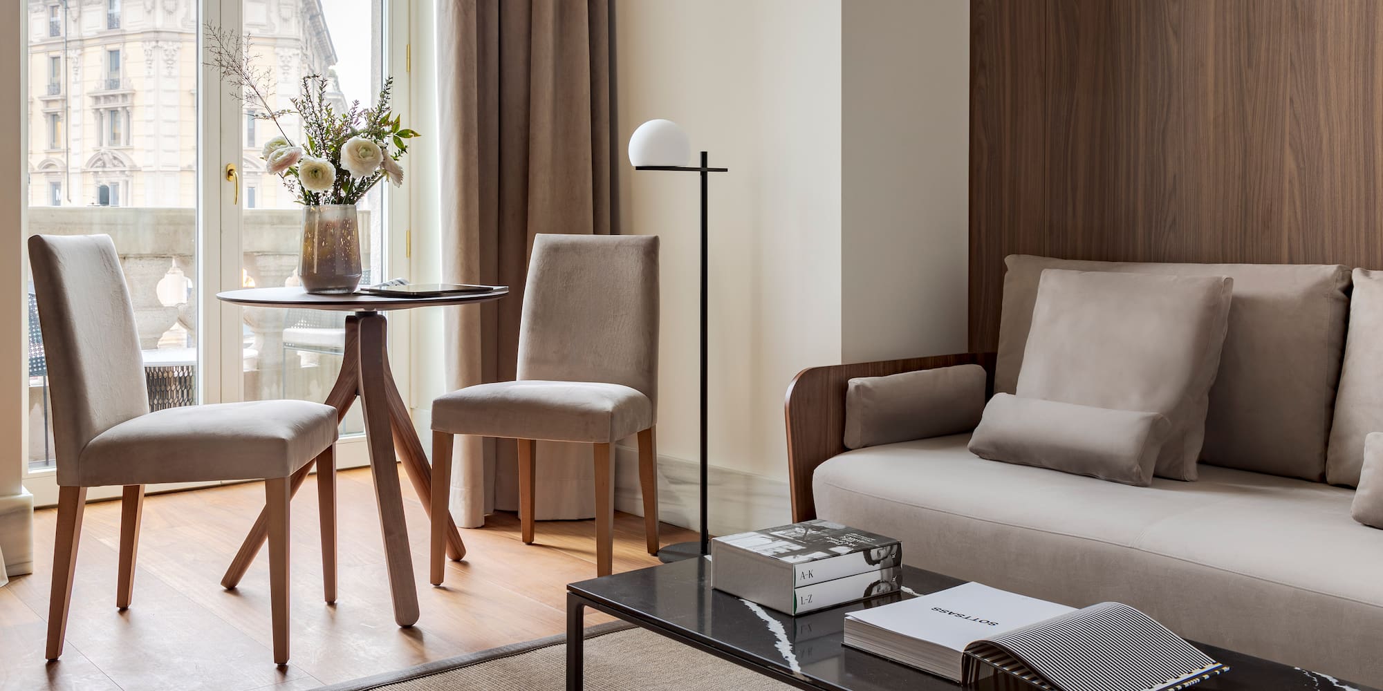 a living room with a couch and chairs