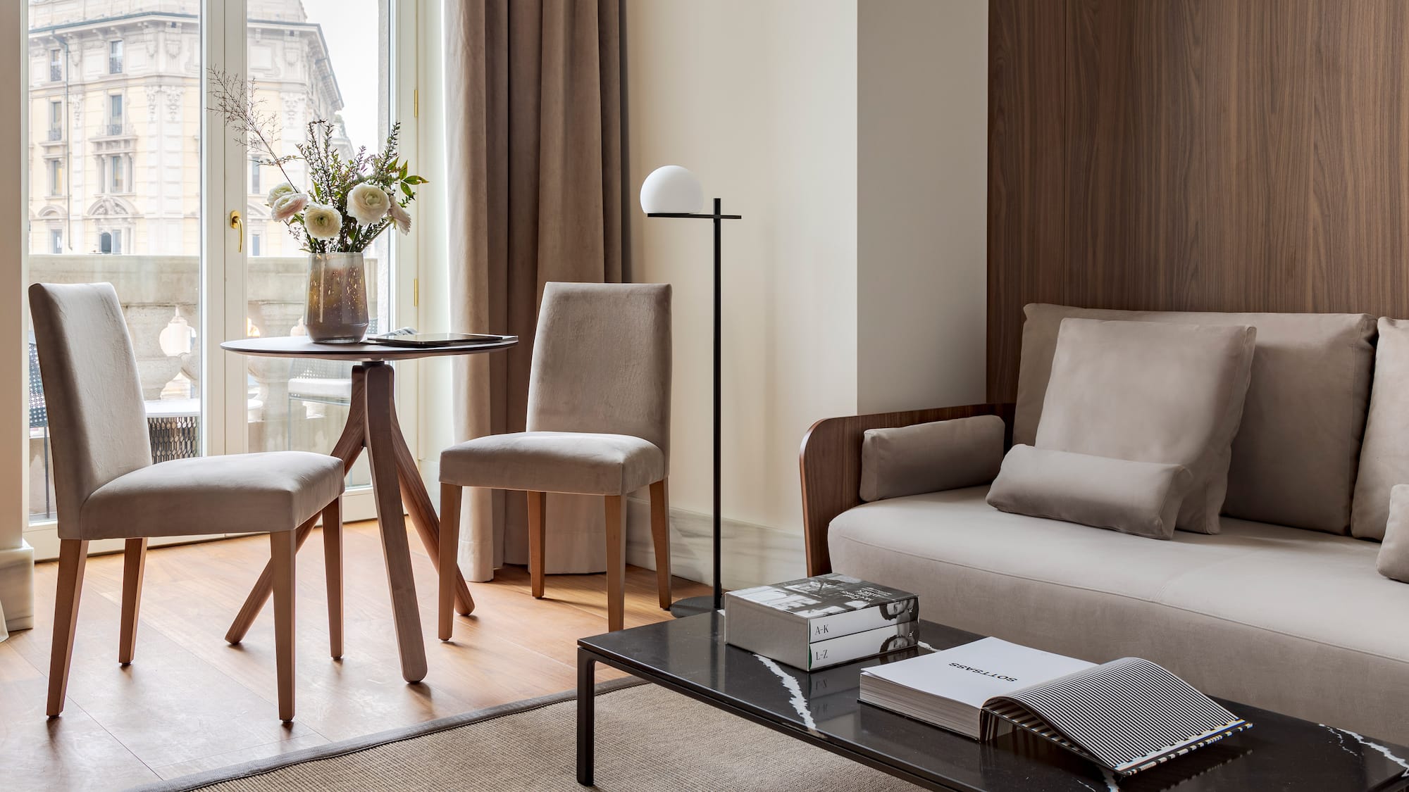 a living room with a couch and chairs