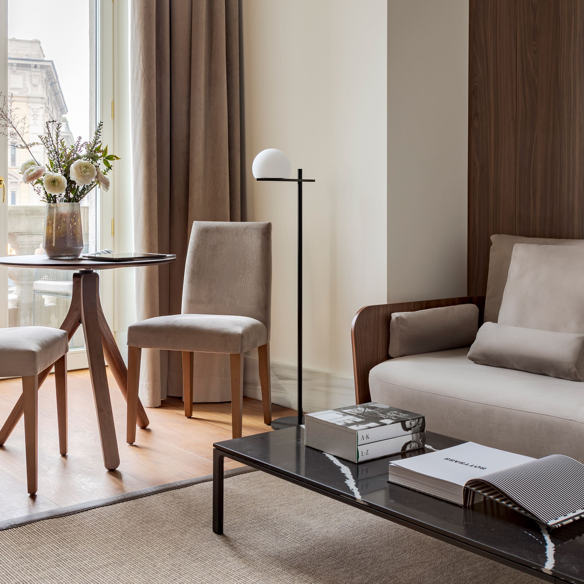 a living room with a couch and chairs