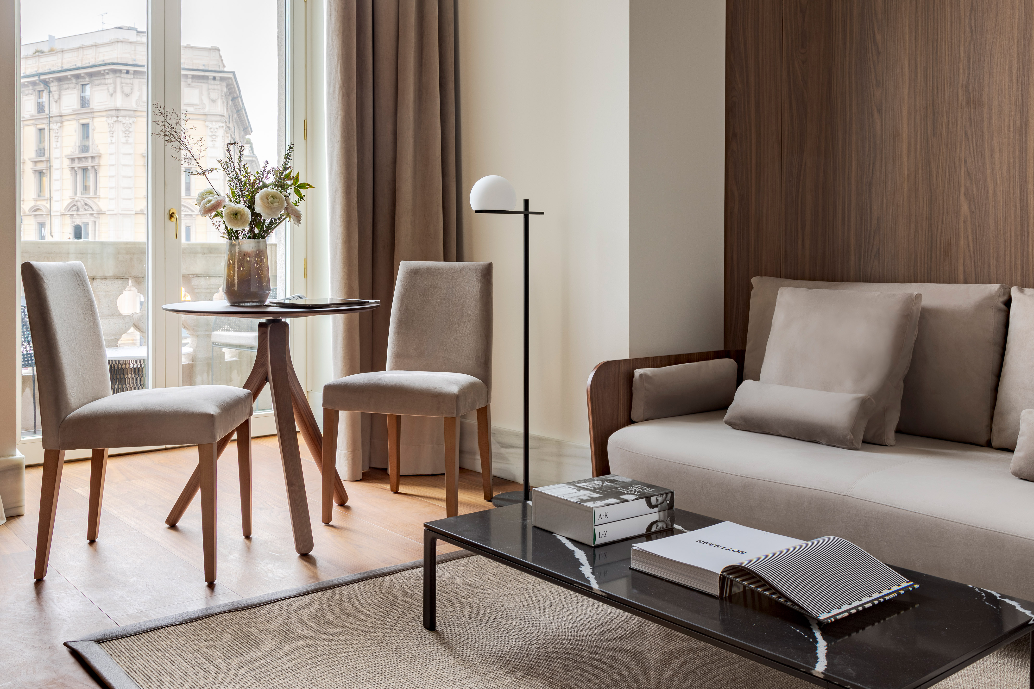 a living room with a couch and chairs