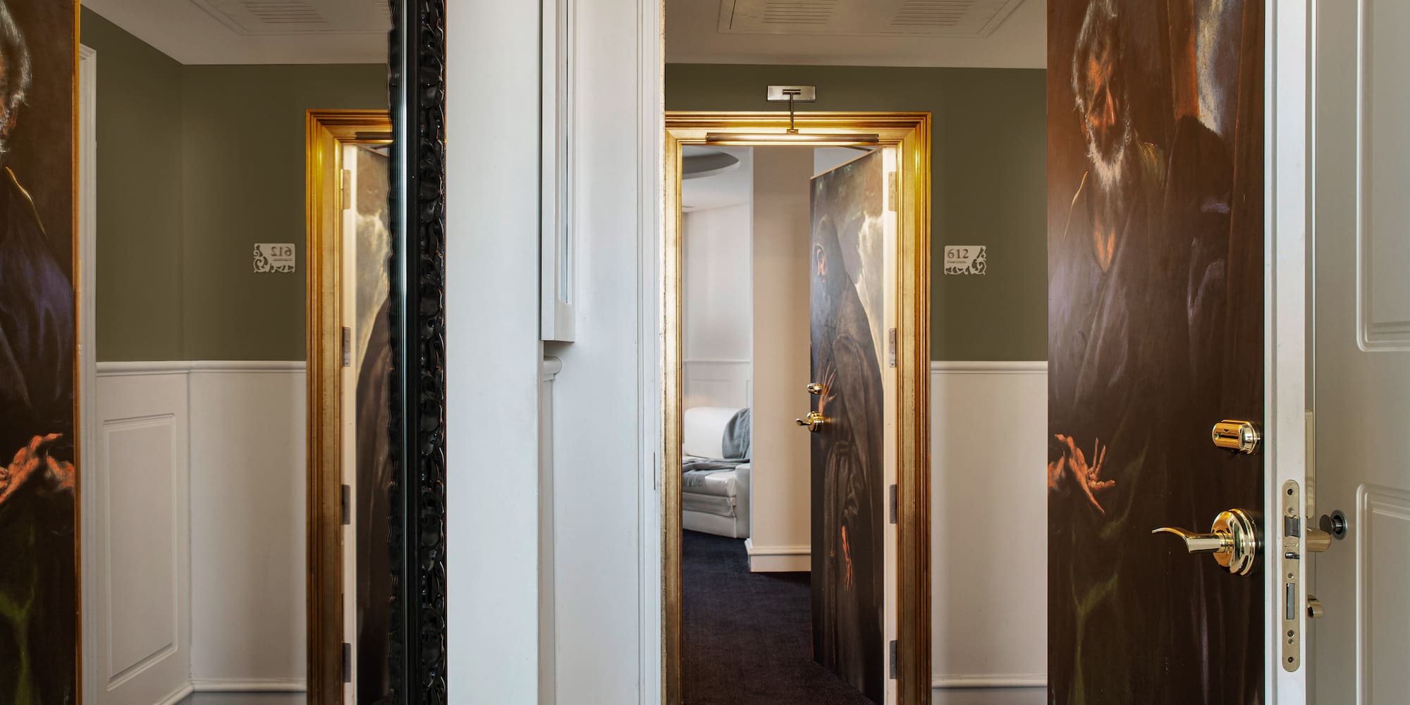 a room with a painting on the door