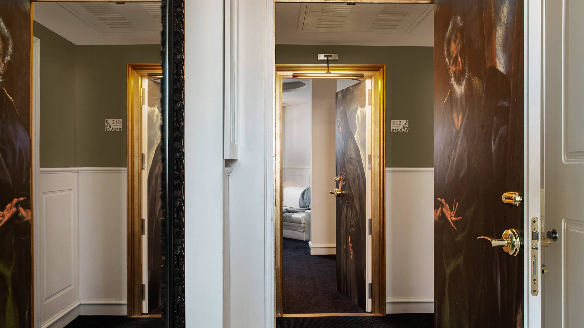 a room with a painting on the door