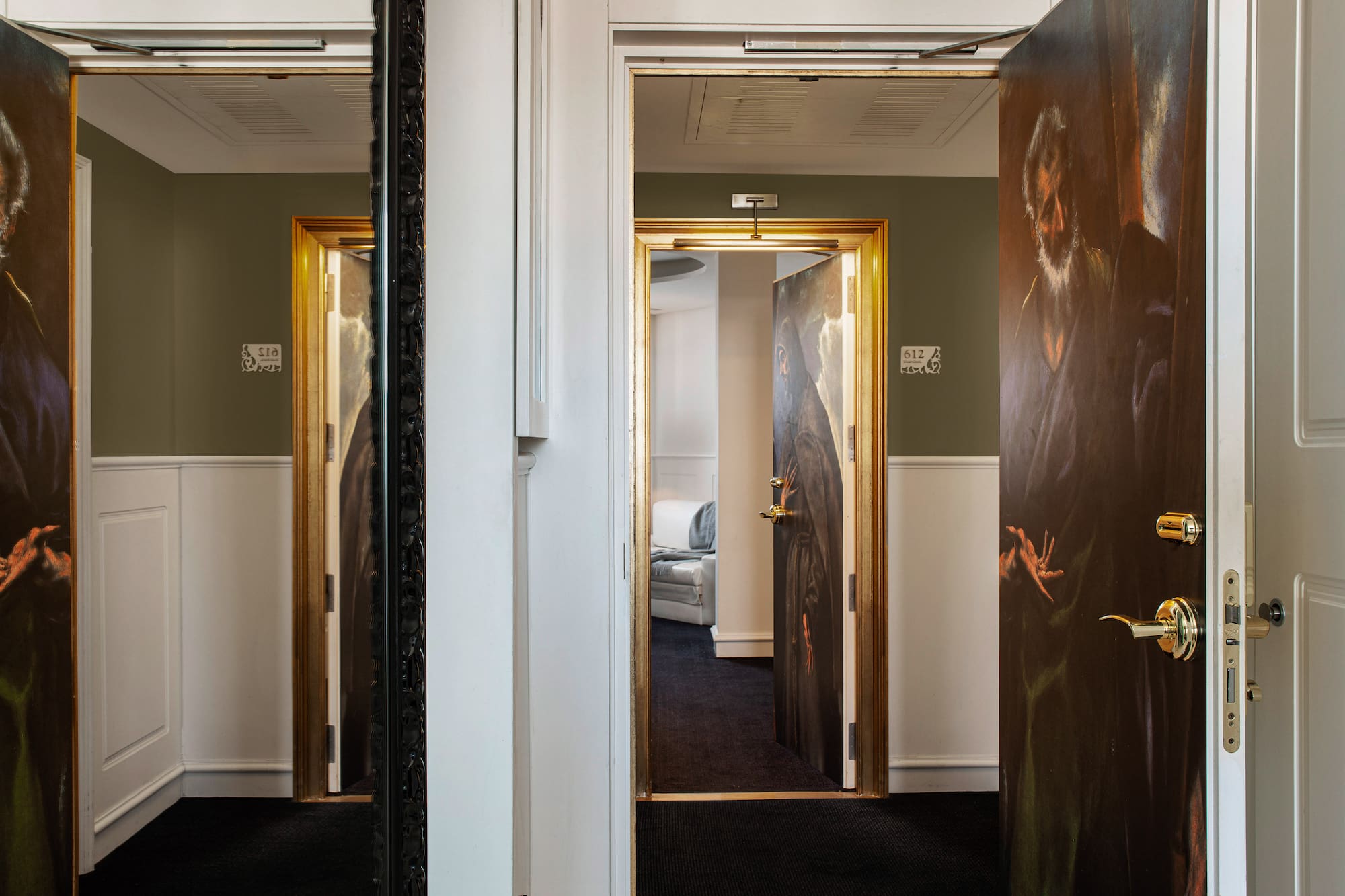 a room with a painting on the door