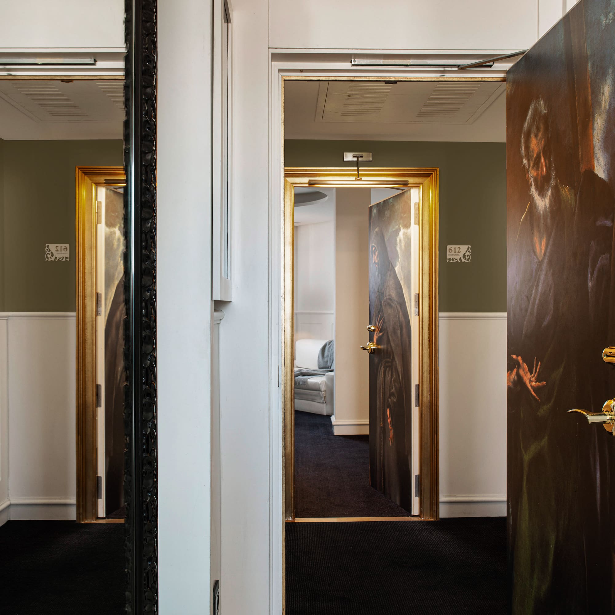 a room with a painting on the door