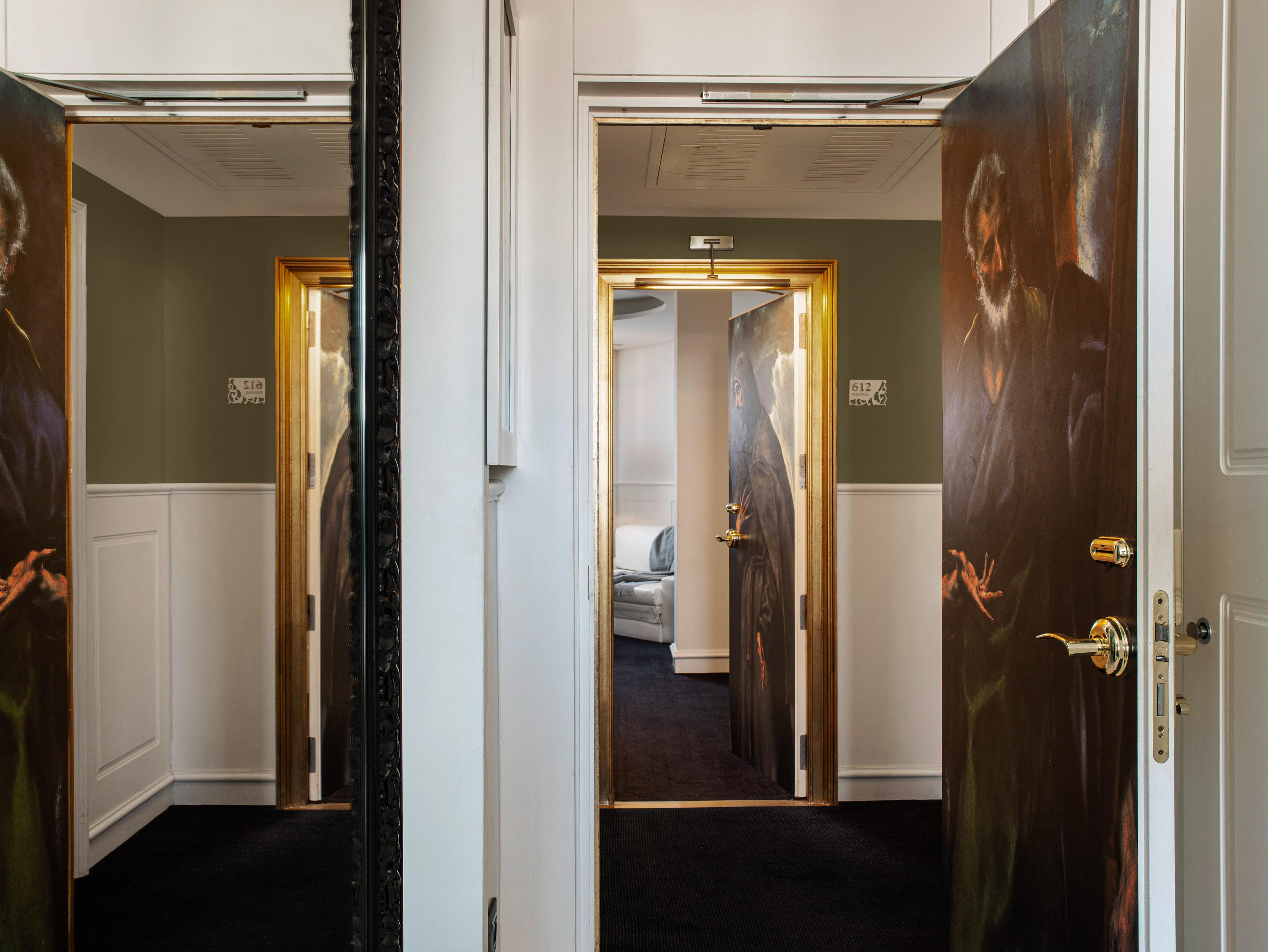 a room with a painting on the door