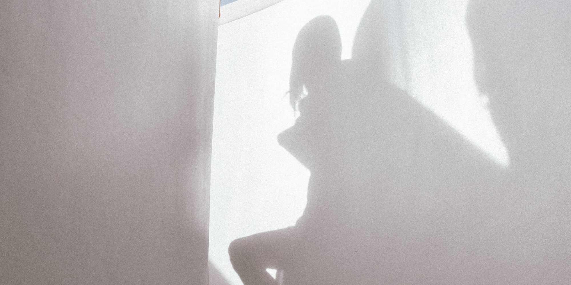 a shadow of a person on a staircase