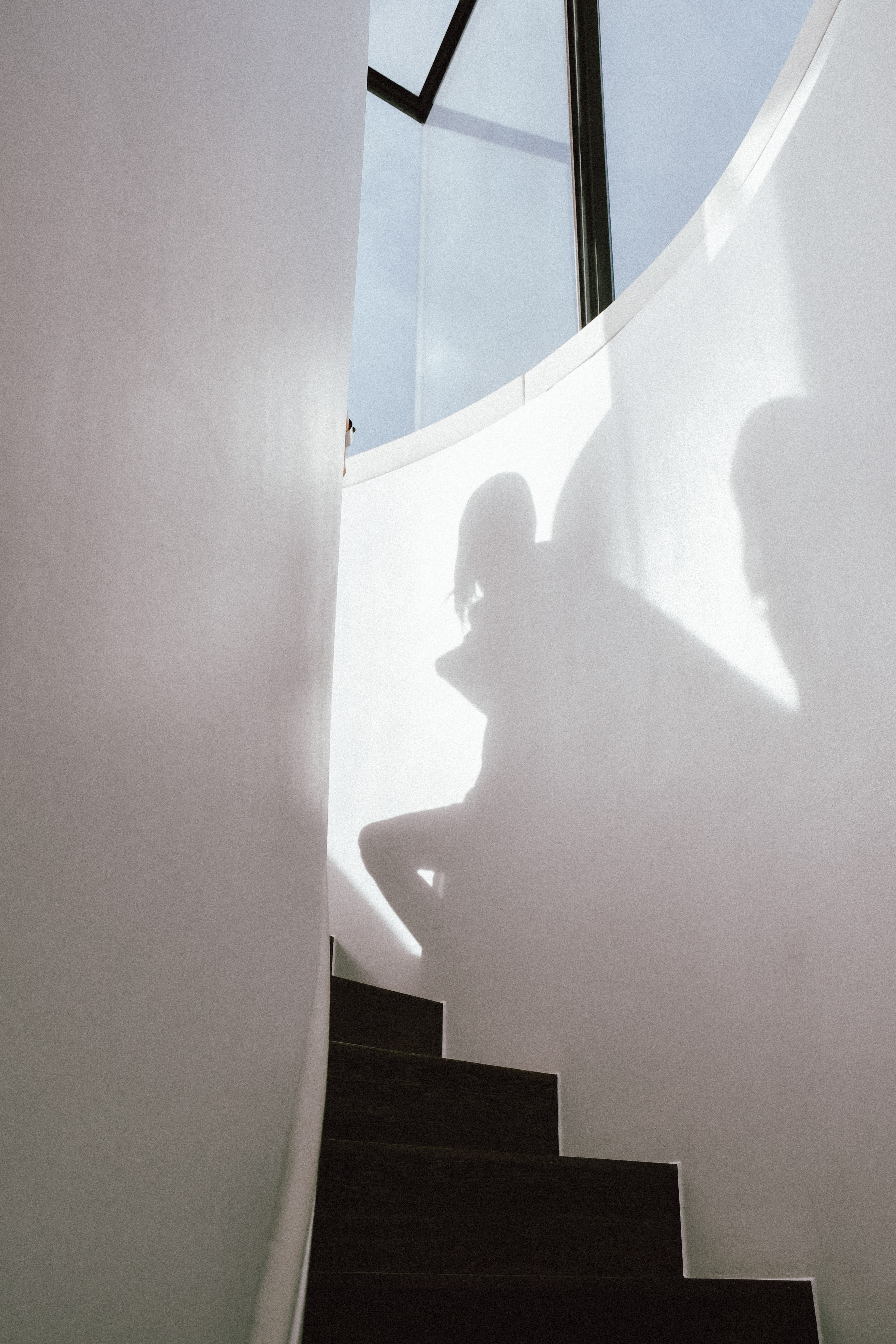 a shadow of a person on a staircase
