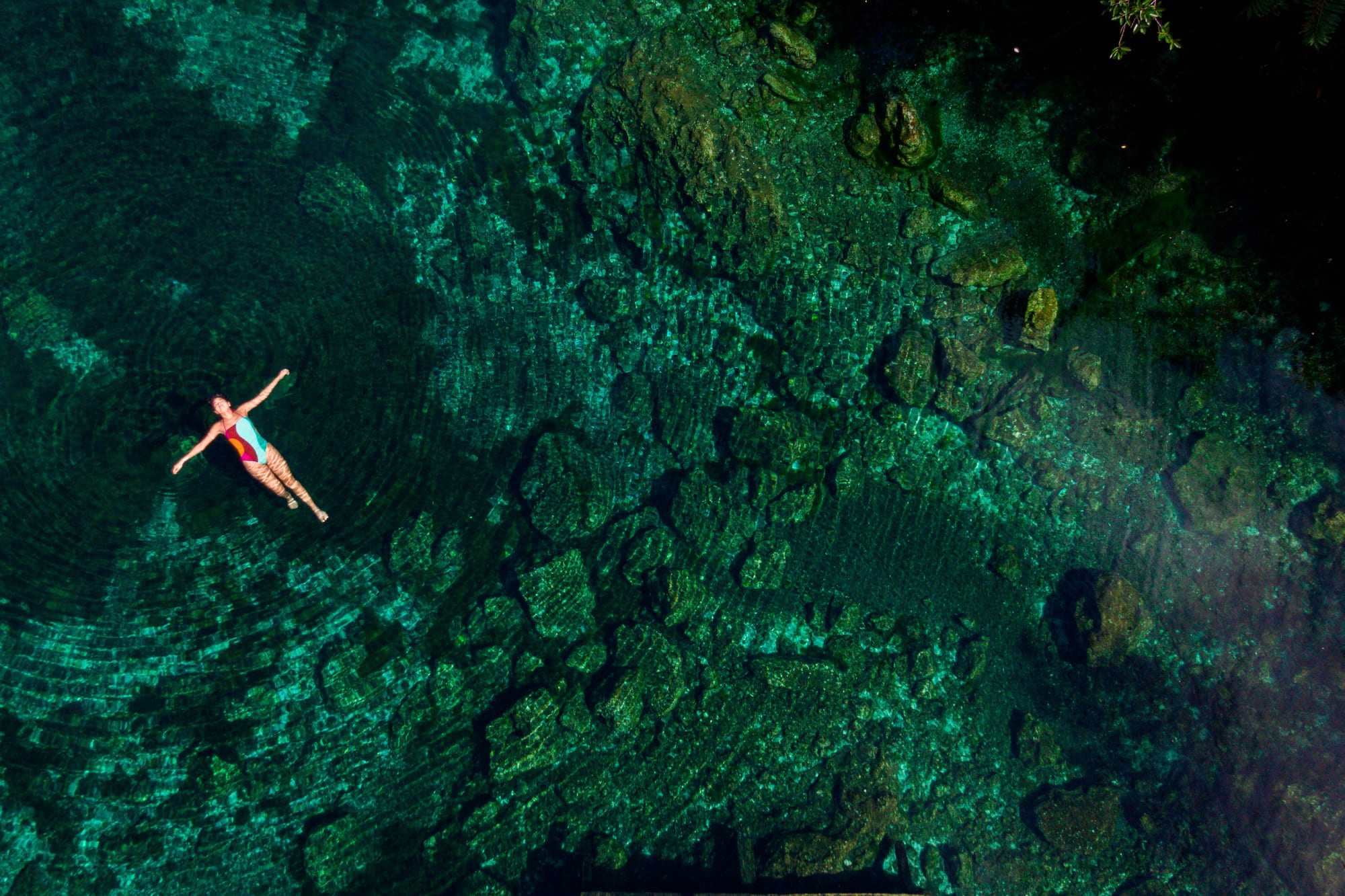 a woman floating in a pool of water