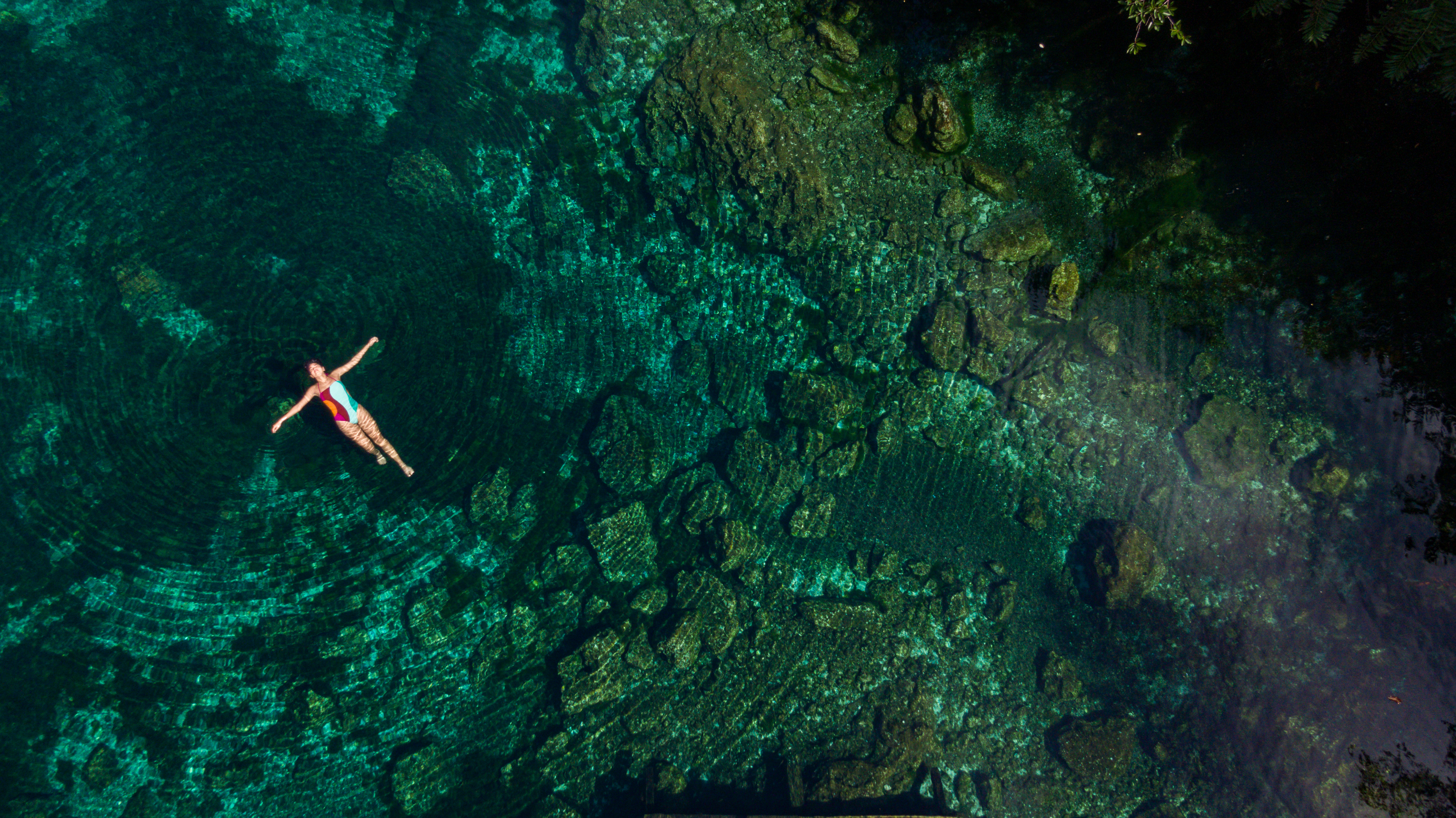 a woman floating in a pool of water