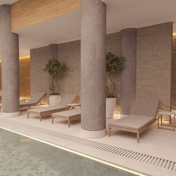 a pool with chairs and trees