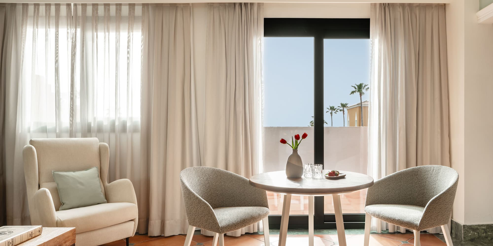 a room with a table and chairs