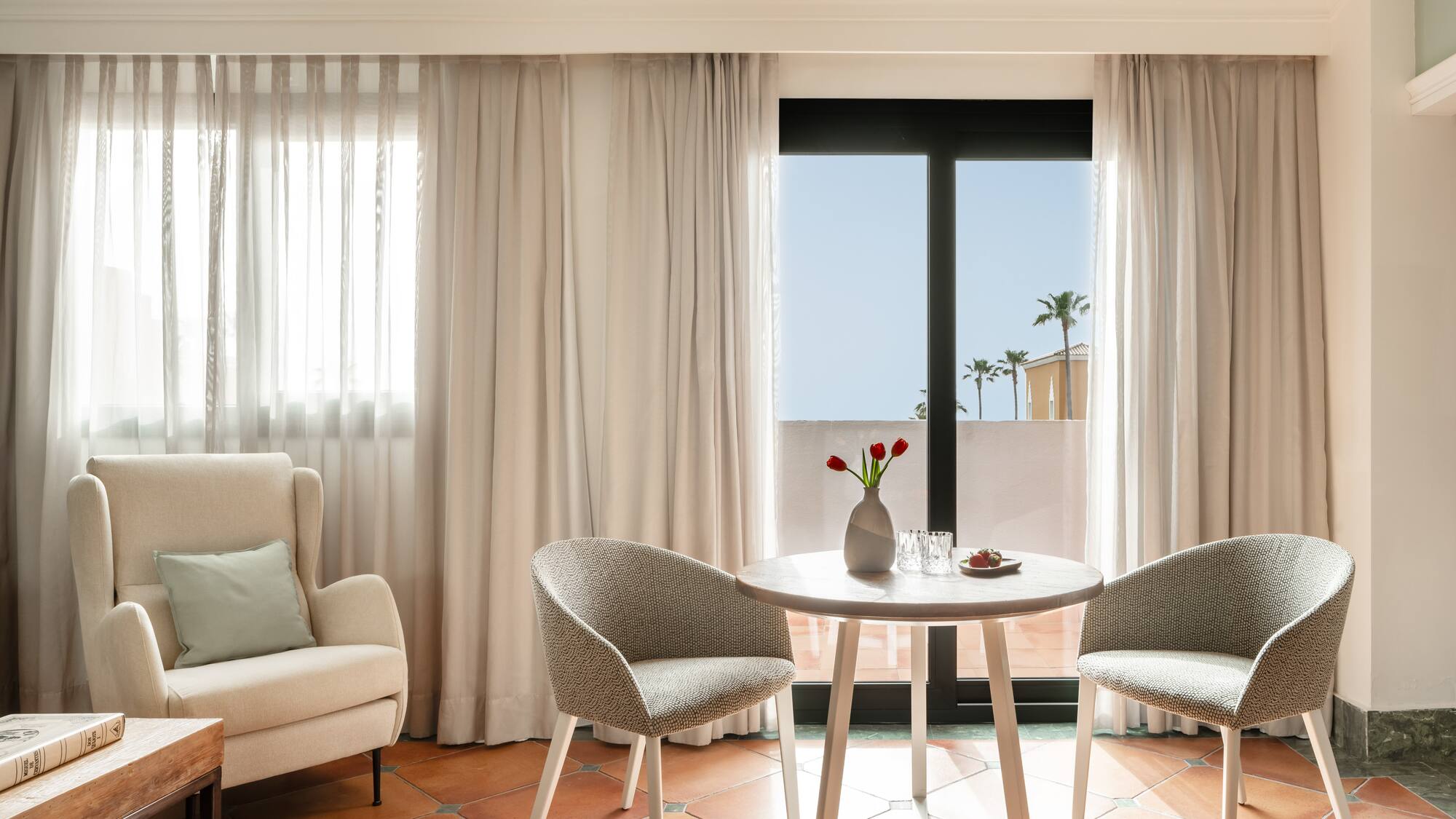 a room with a table and chairs