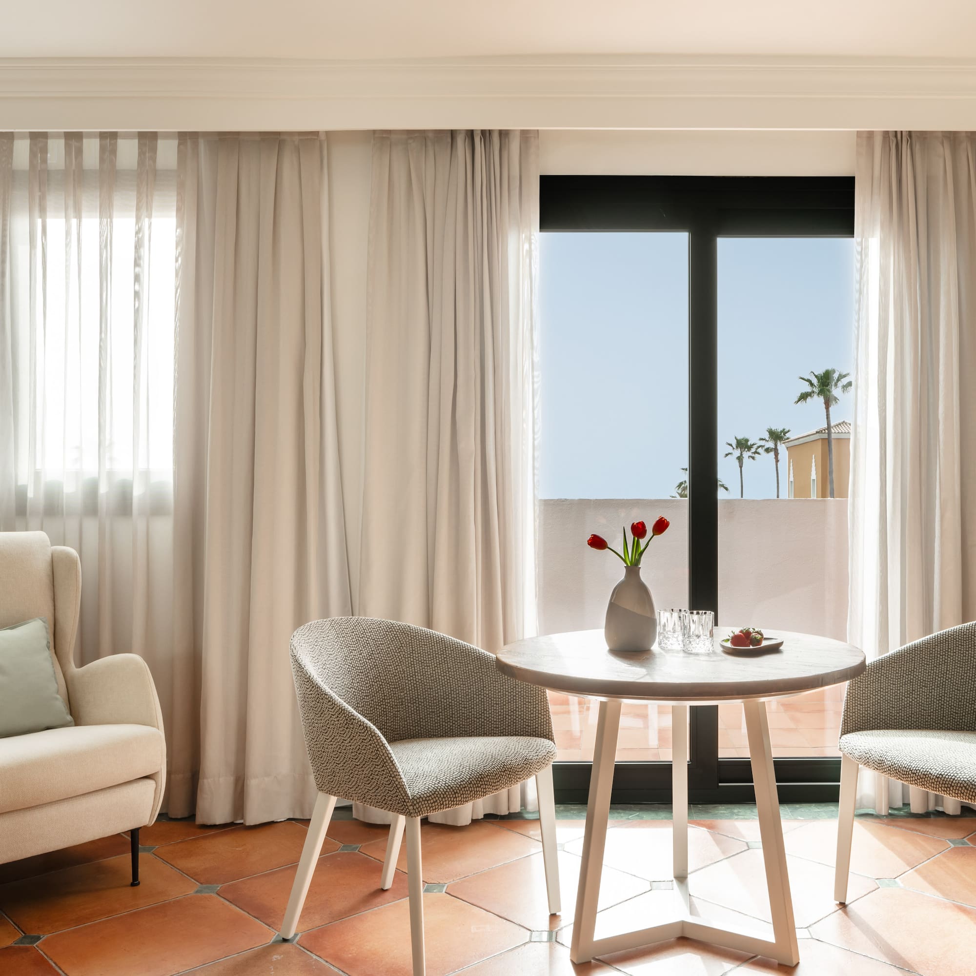 a room with a table and chairs