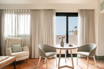 a room with a table and chairs