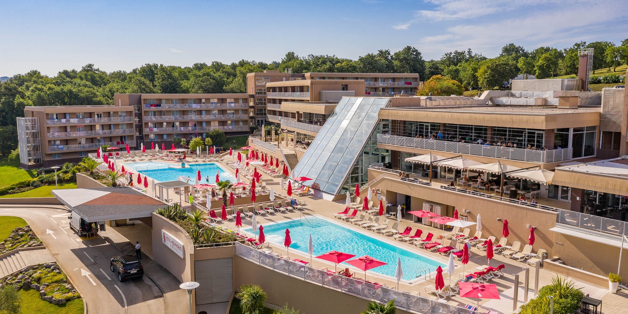a pool and a building with a slide