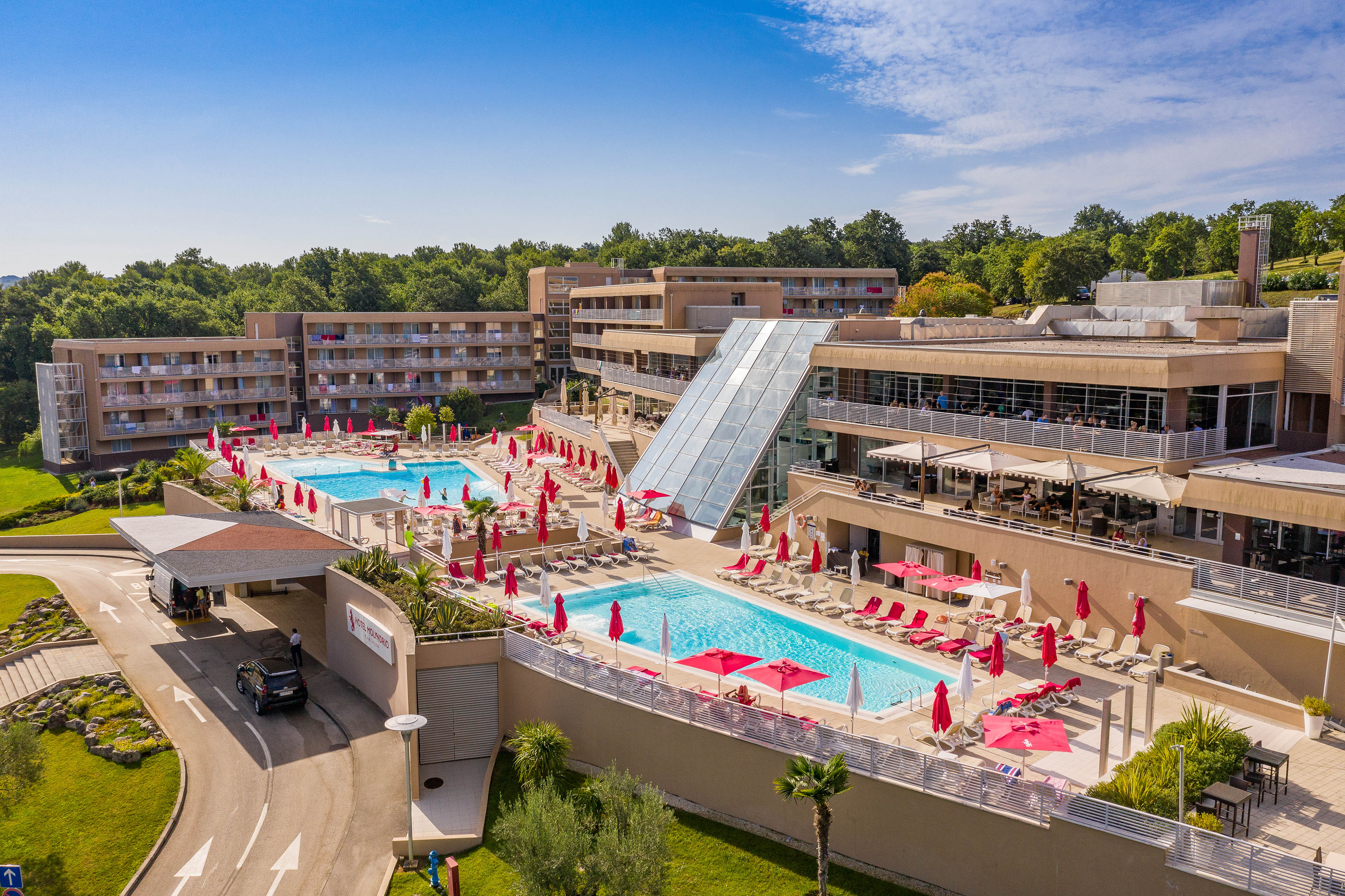 a pool and a building with a slide