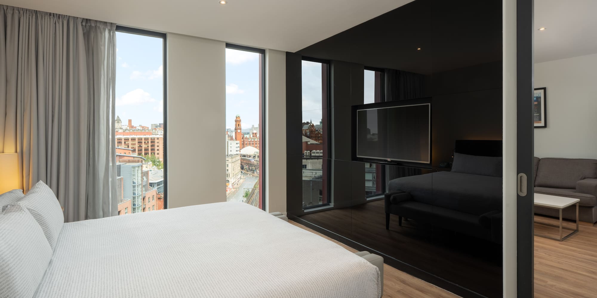 a bedroom with a large window