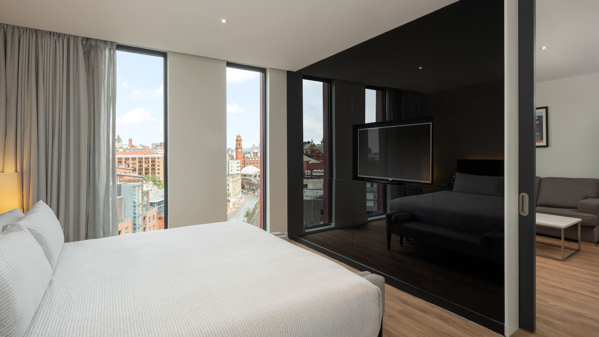 a bedroom with a large window