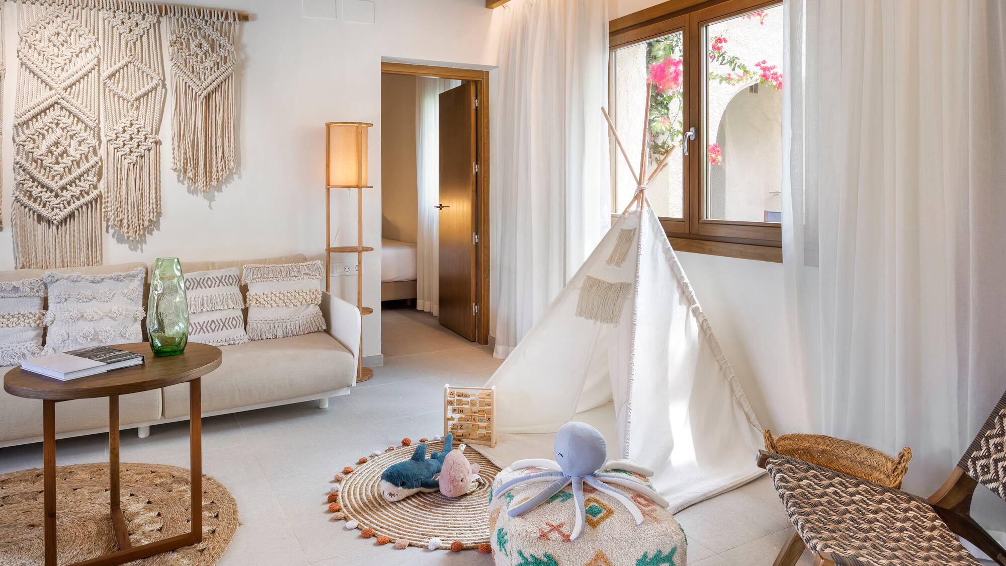 a room with a tent and furniture