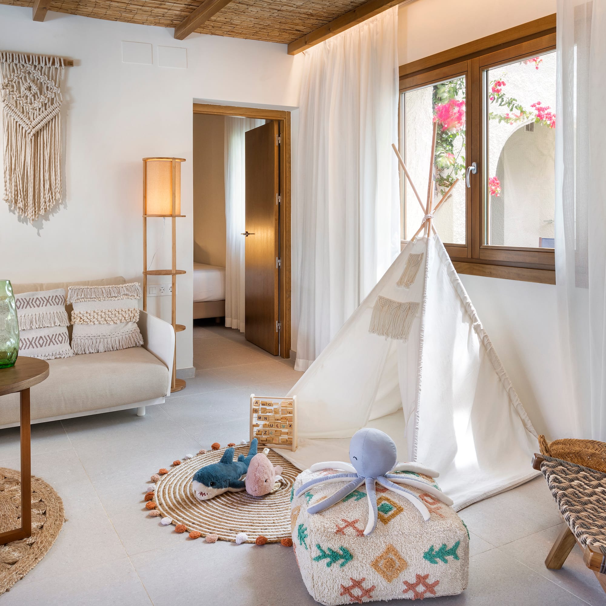 a room with a tent and furniture