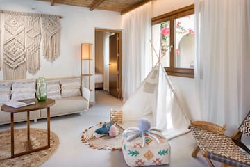 a room with a tent and furniture