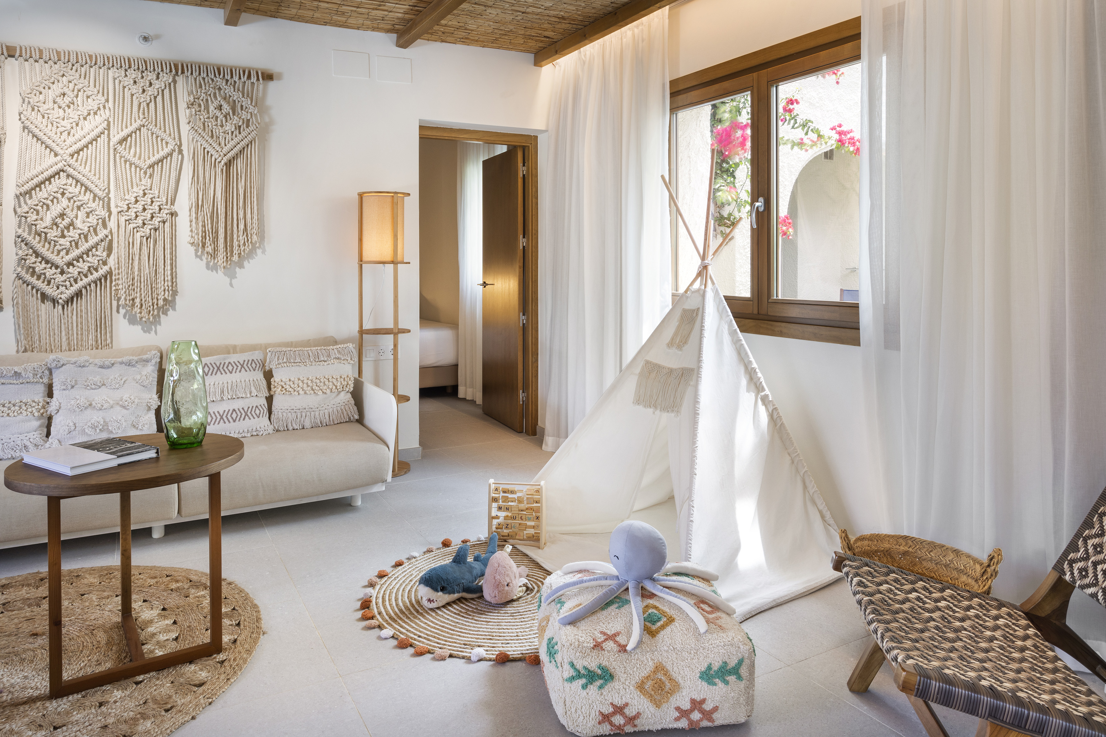 a room with a tent and furniture