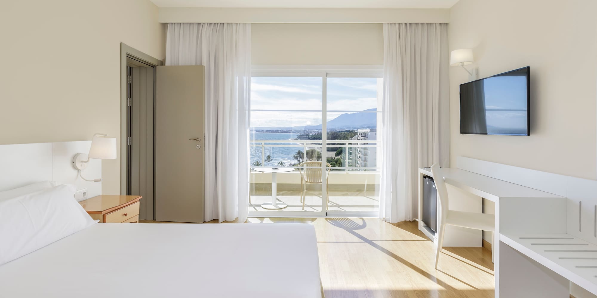 a room with a television and a bed