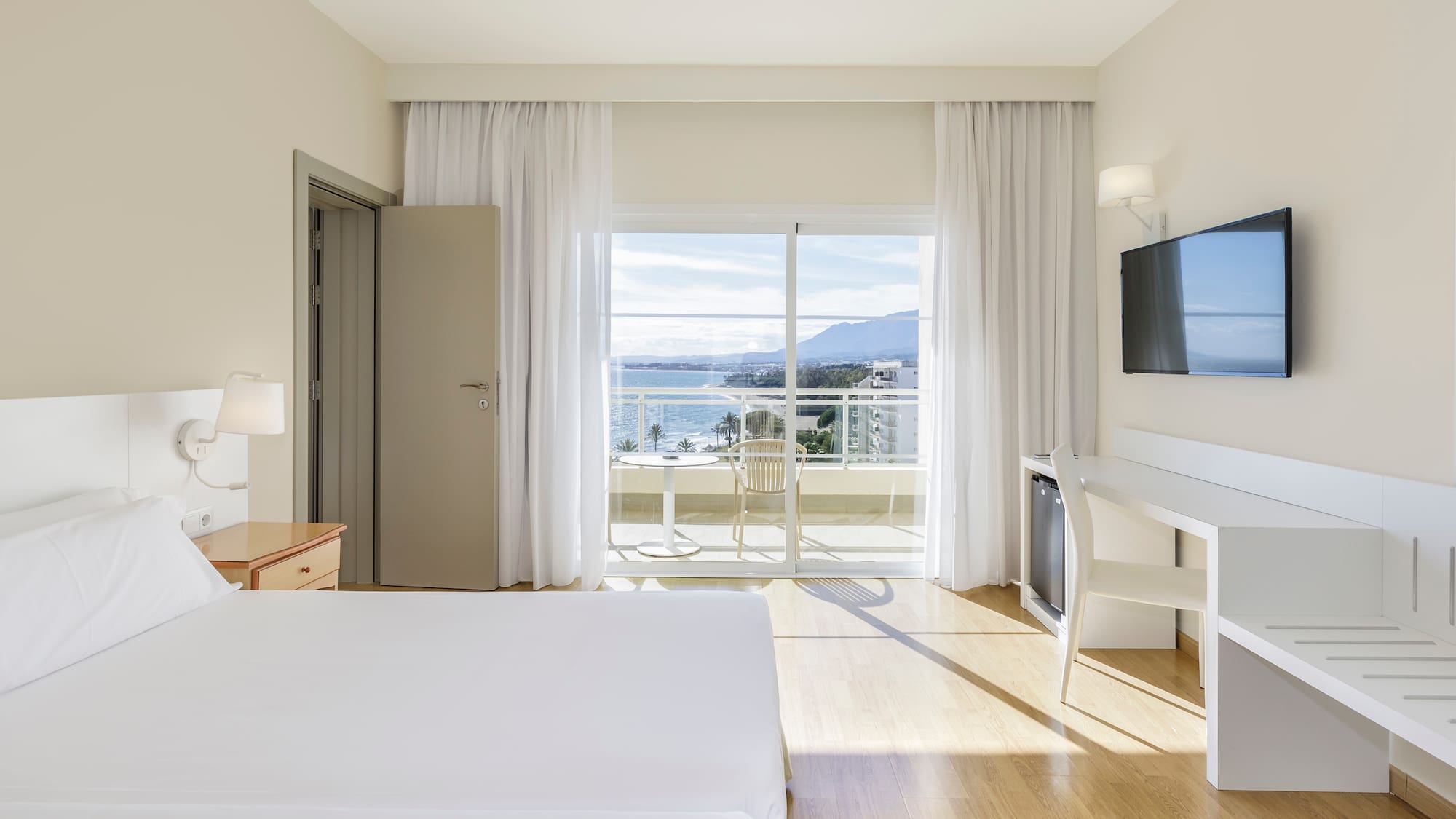 a room with a television and a bed