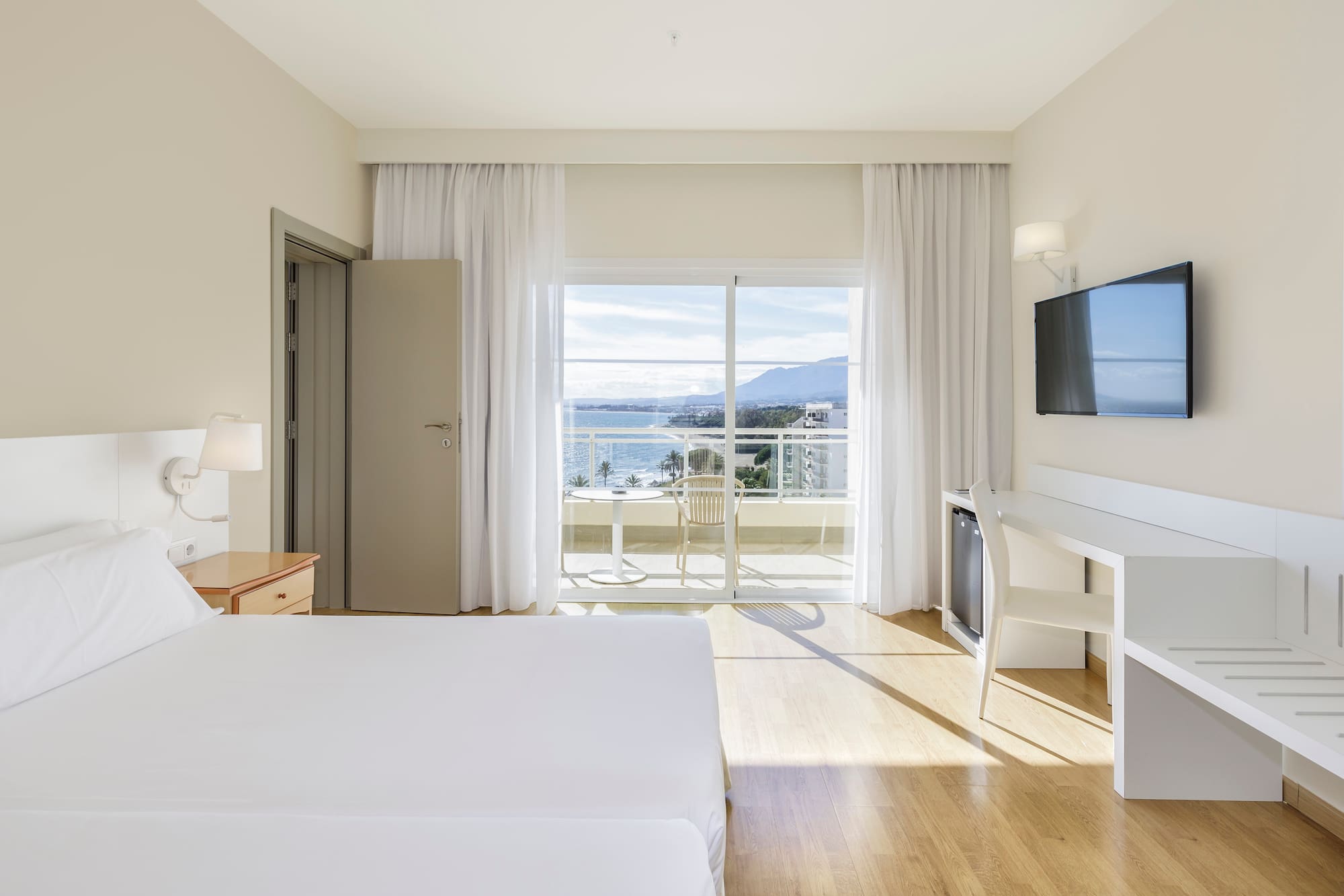 a room with a television and a bed