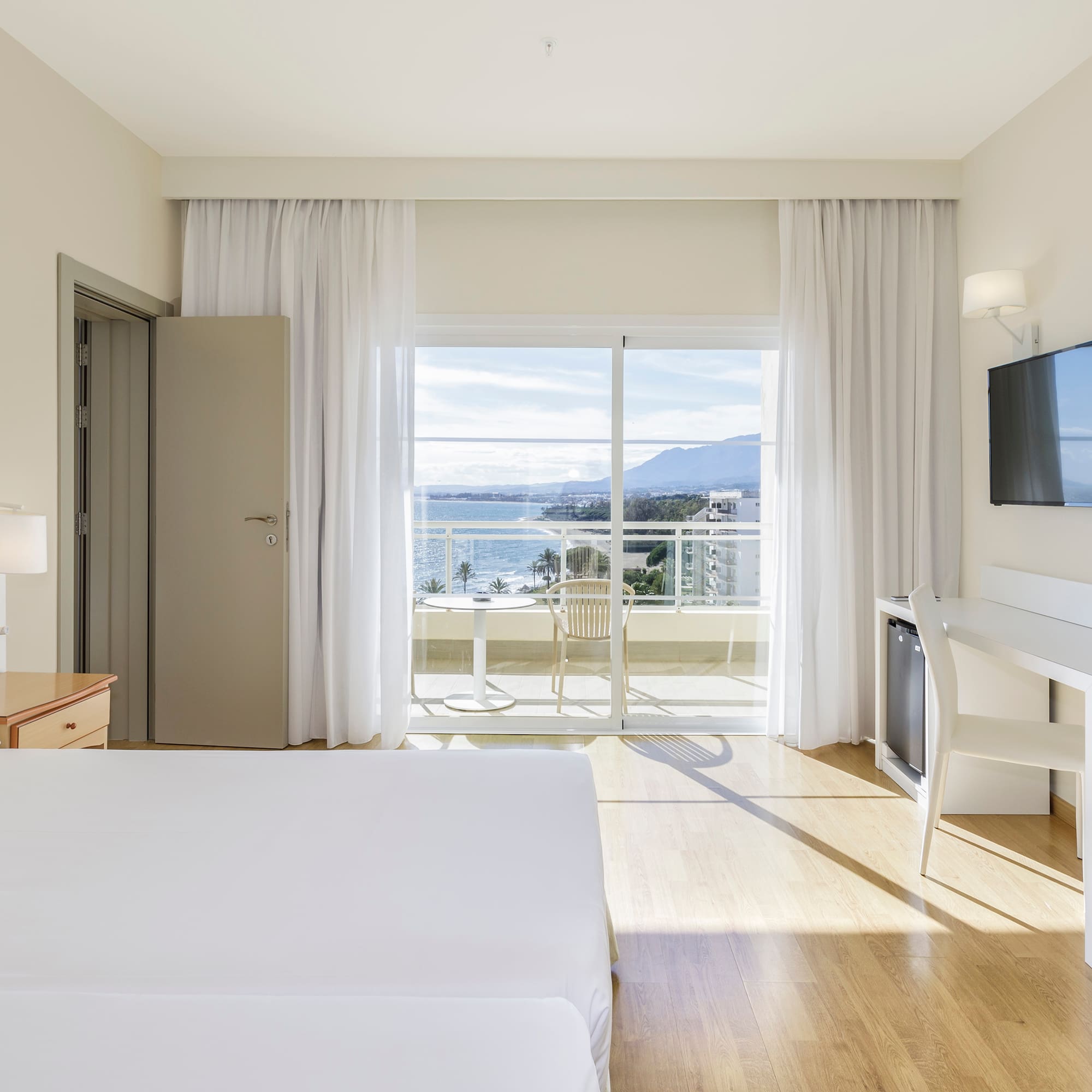 a room with a television and a bed