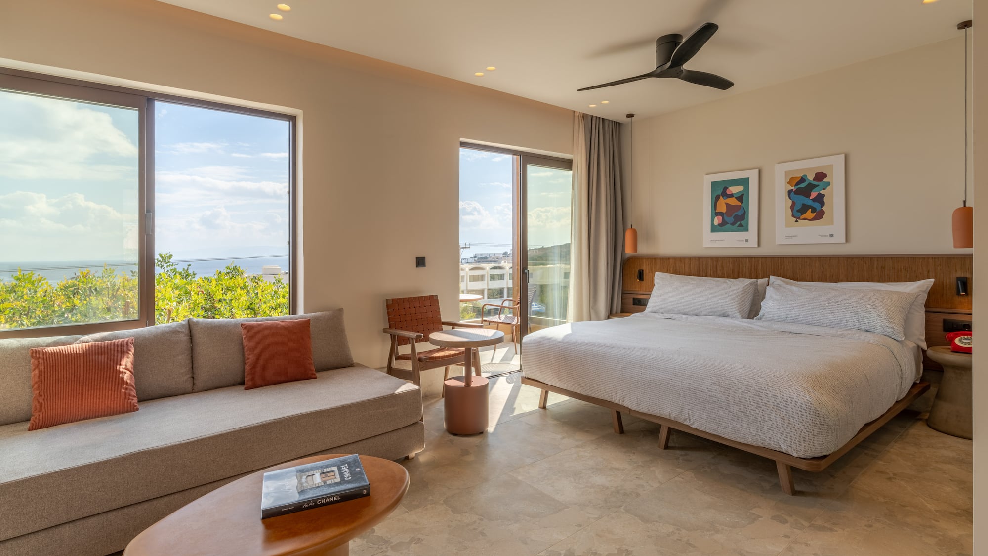 a room with a bed and couches