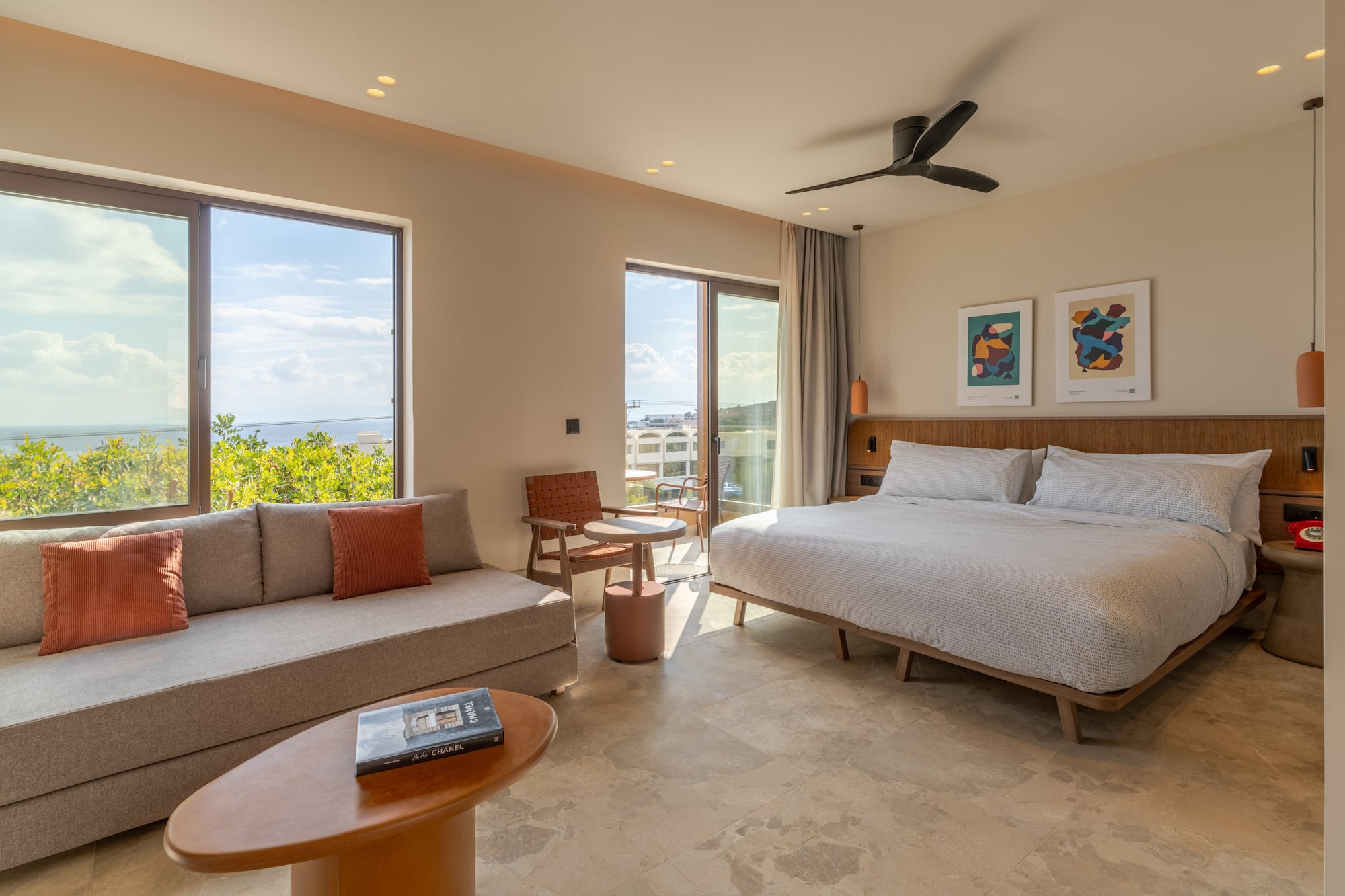 a room with a bed and couches