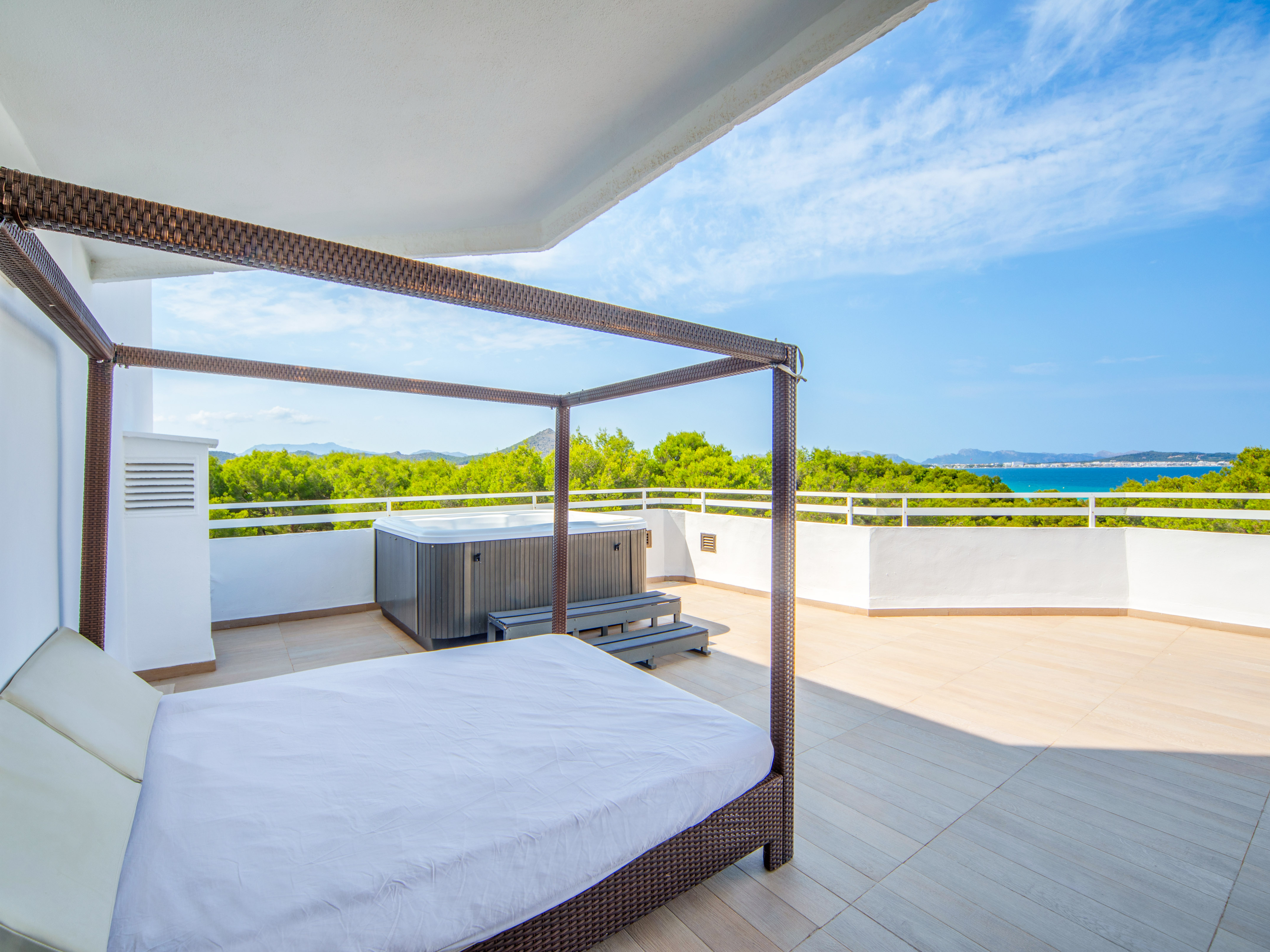 a bed on a deck