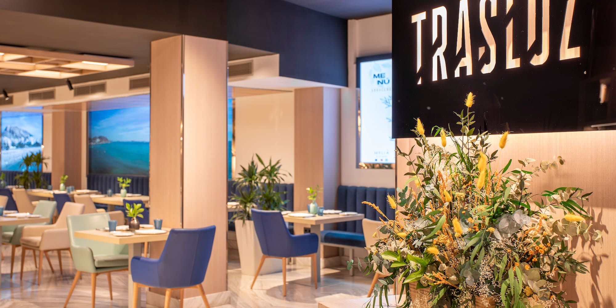 a room with blue chairs and a sign