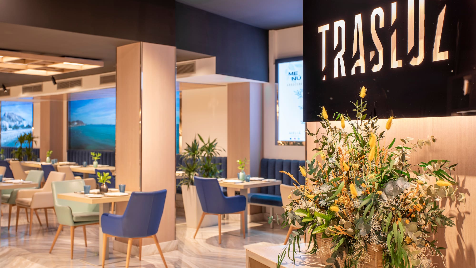 a room with blue chairs and a sign