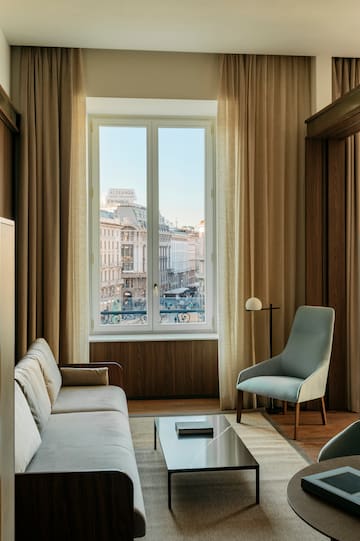 a living room with a couch and a window