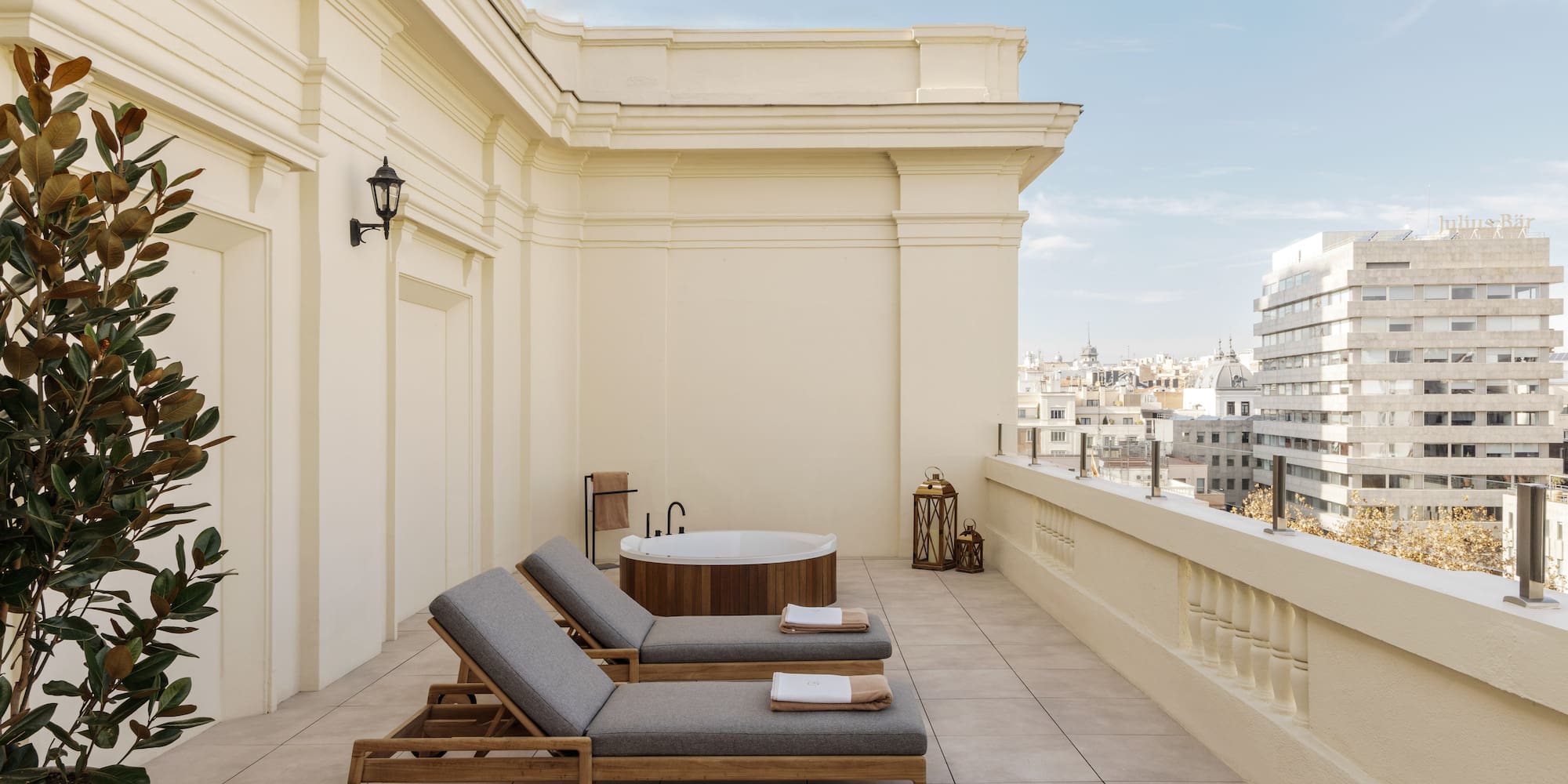 a deck with chairs and a hot tub