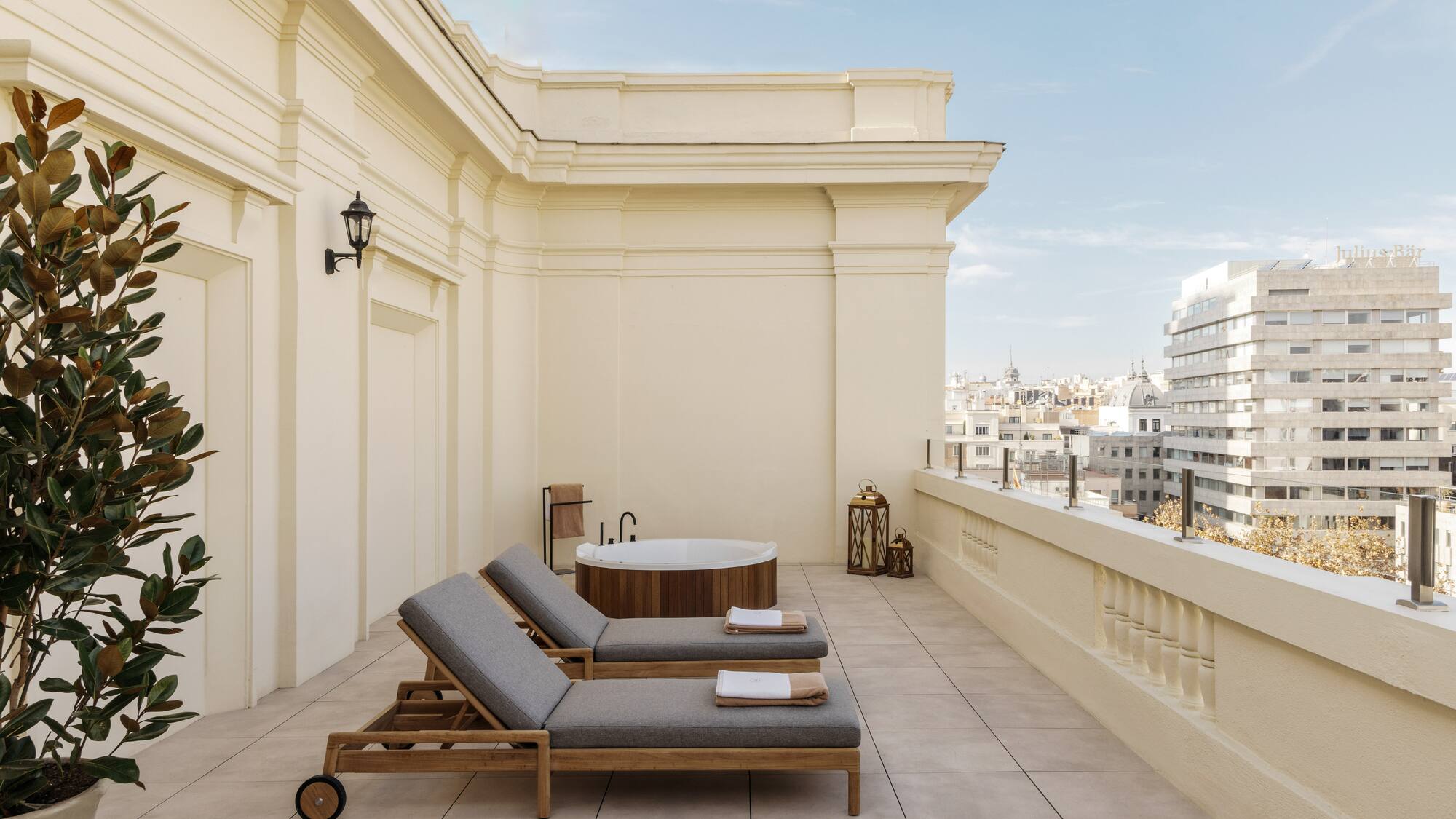 a deck with chairs and a hot tub