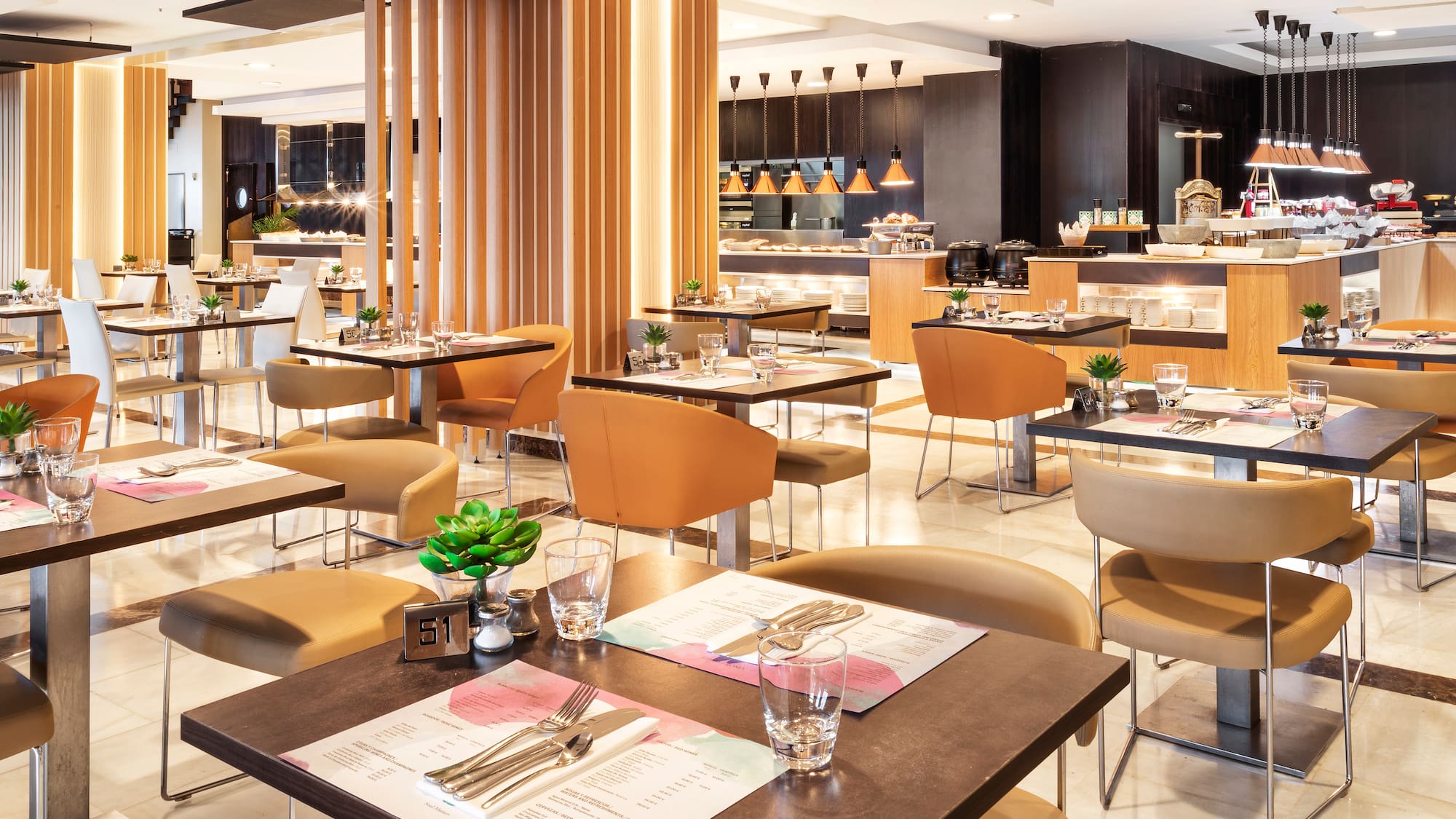 a restaurant with tables and chairs