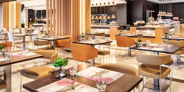 a restaurant with tables and chairs